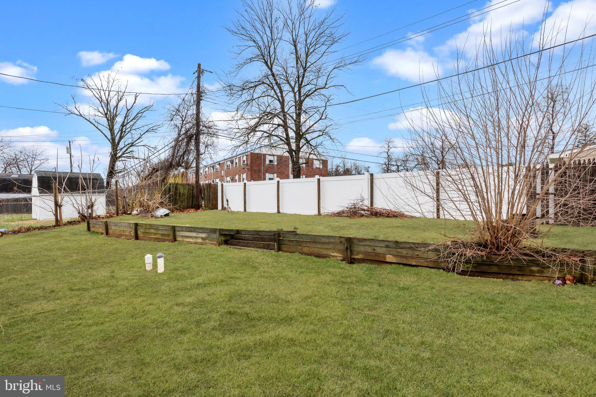 19 Violet Road Levittown, PA 19057 - Photo 25 of 26 a swimming pool with outdoor seating and yard