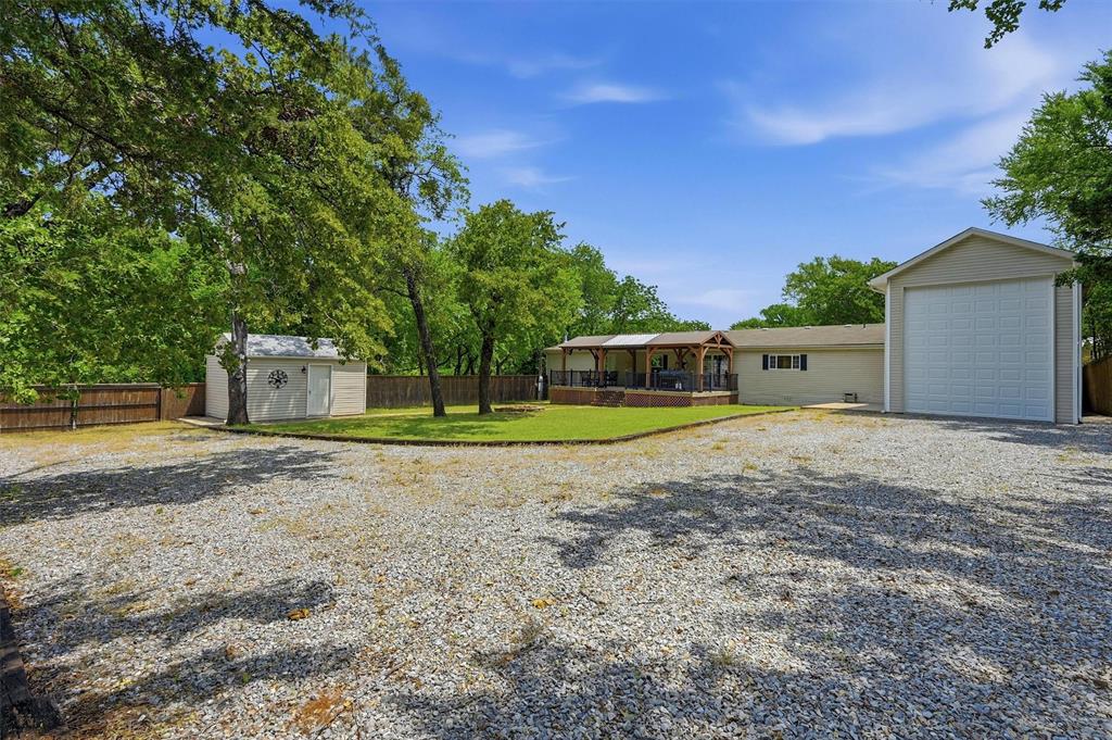 212 Sunset Road Pottsboro, TX 75076 - Photo 4 of 40 a view of a house with a yard