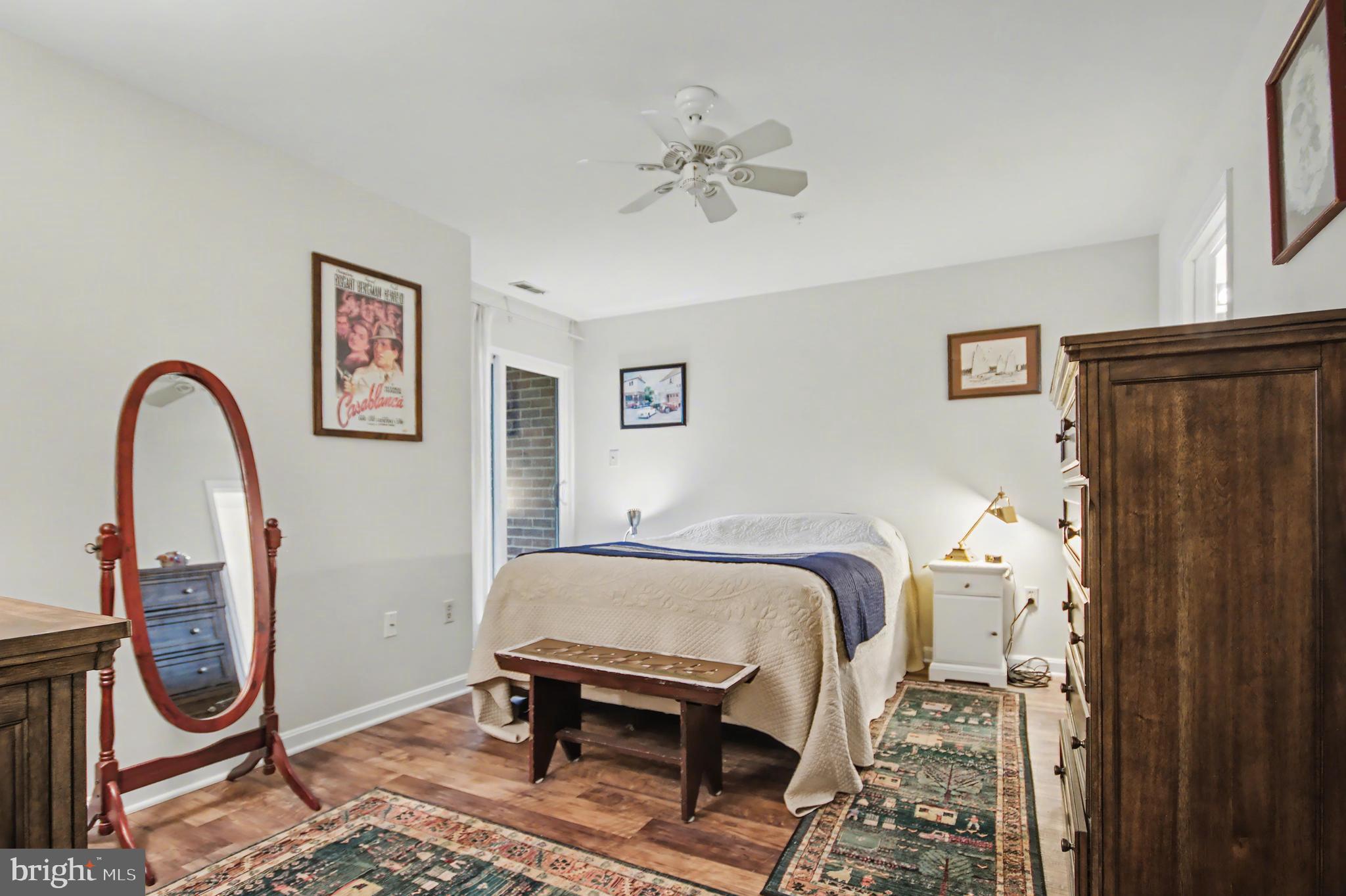 2900 Shipmaster Way, Unit 312 Annapolis, MD 21401 - Photo 17 of 56 a bedroom with bed and a mirror