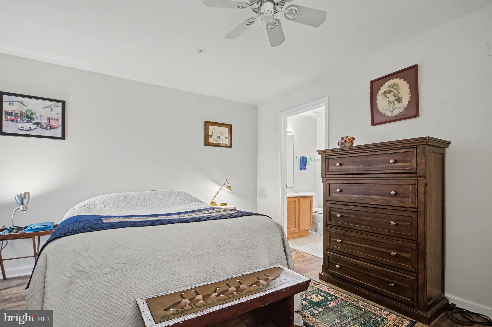 2900 Shipmaster Way, Unit 312 Annapolis, MD 21401 - Photo 20 of 56 a bedroom with a bed and a dresser