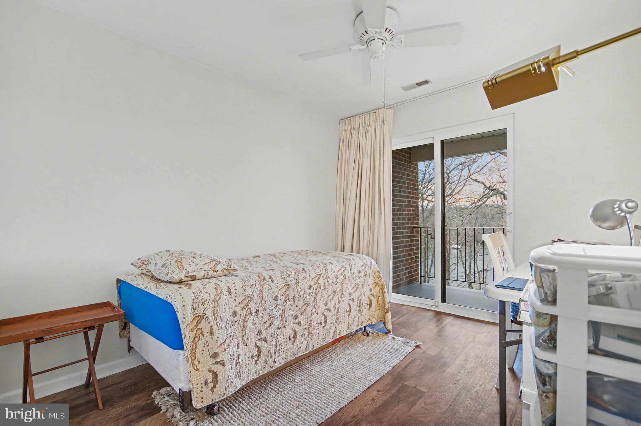 2900 Shipmaster Way, Unit 312 Annapolis, MD 21401 - Photo 23 of 56 a bedroom with a bed and a window