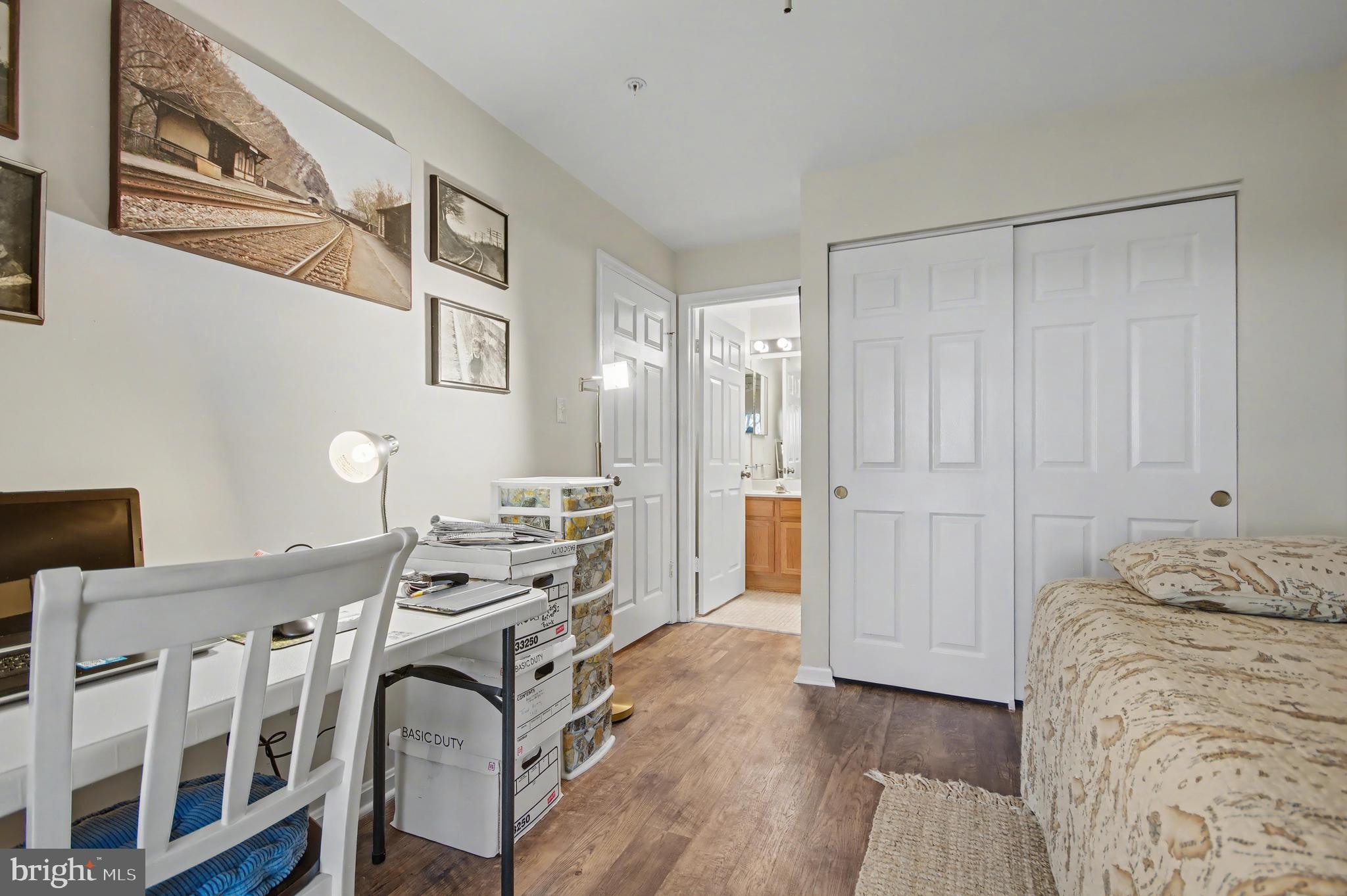 2900 Shipmaster Way, Unit 312 Annapolis, MD 21401 - Photo 24 of 56 a view of a bedroom with furniture and windows