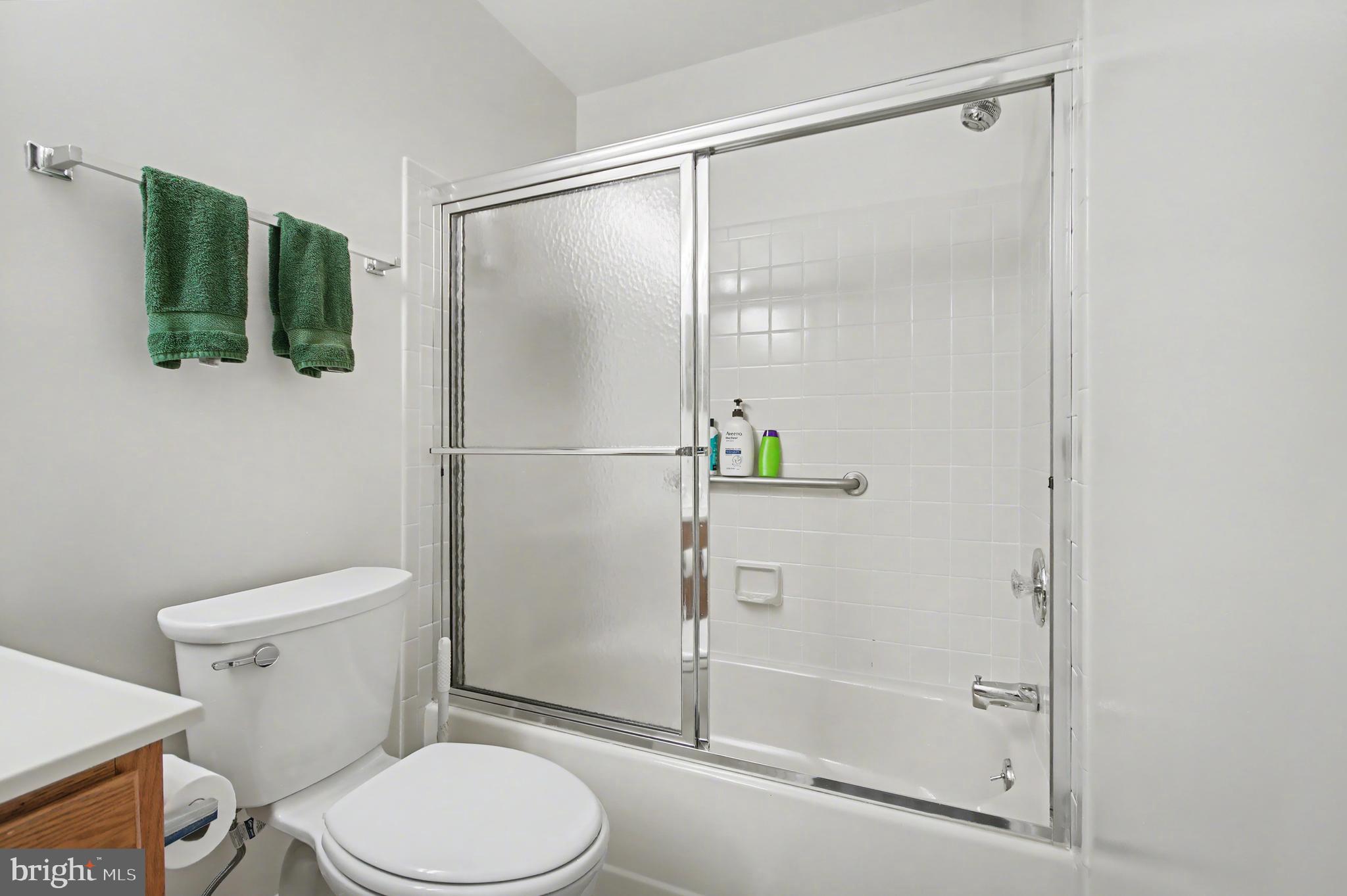 2900 Shipmaster Way, Unit 312 Annapolis, MD 21401 - Photo 26 of 56 a white toilet next to a bathroom