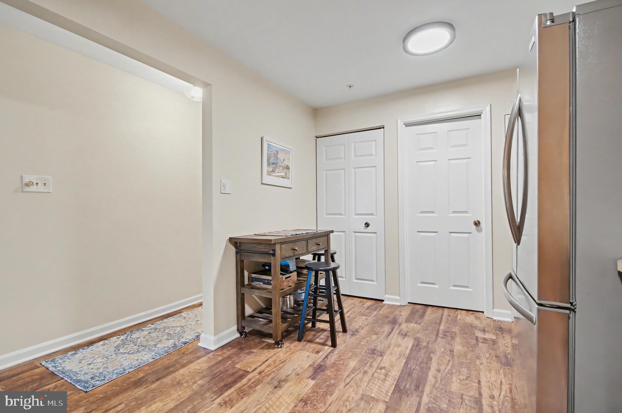2900 Shipmaster Way, Unit 312 Annapolis, MD 21401 - Photo 9 of 56 a view of a room with wooden floor lounge chair and windows