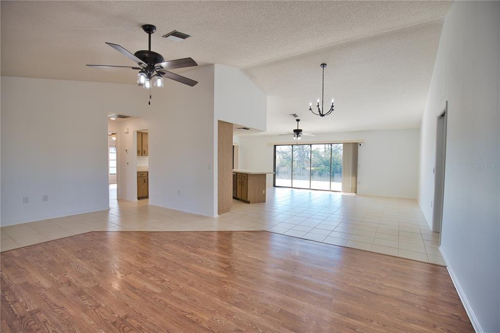 3534 Tundra Road Venice, FL 34293 - Photo 11 of 43 a view of an empty room with wooden floor and a window