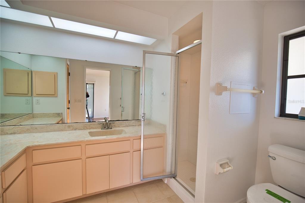 3534 Tundra Road Venice, FL 34293 - Photo 26 of 43 a bathroom with a granite countertop sink mirror and toilet