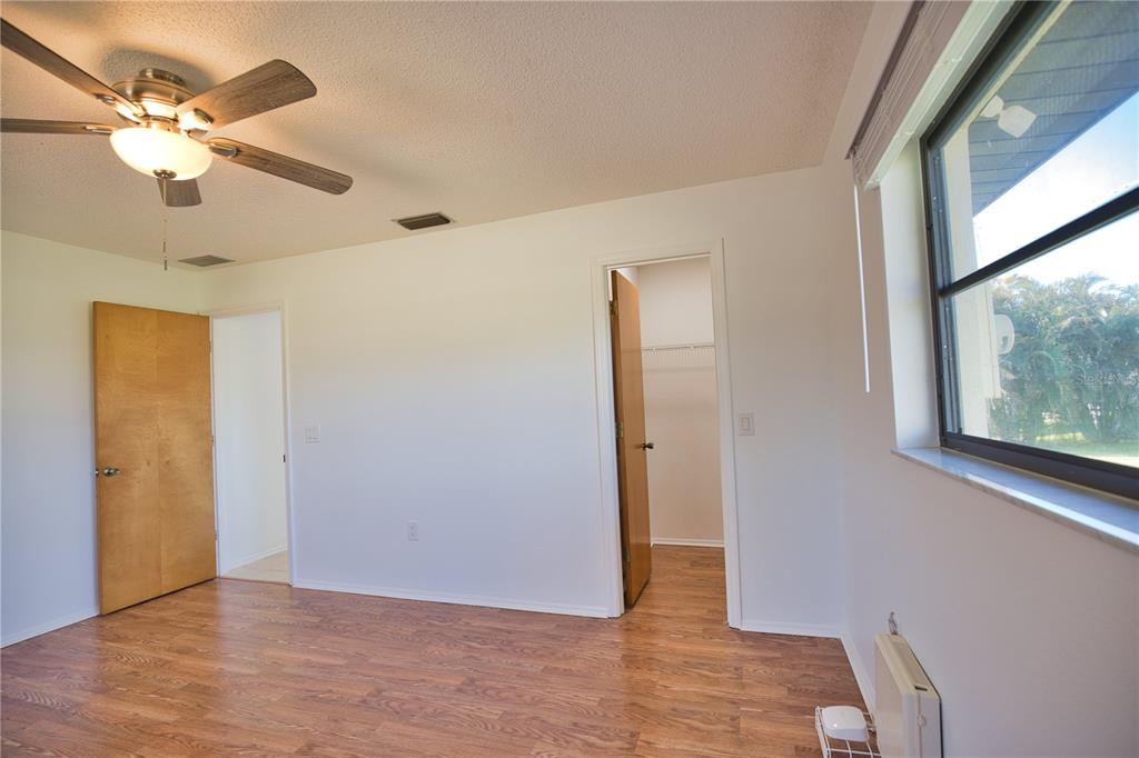 3534 Tundra Road Venice, FL 34293 - Photo 29 of 43 wooden floor in an empty room with a window