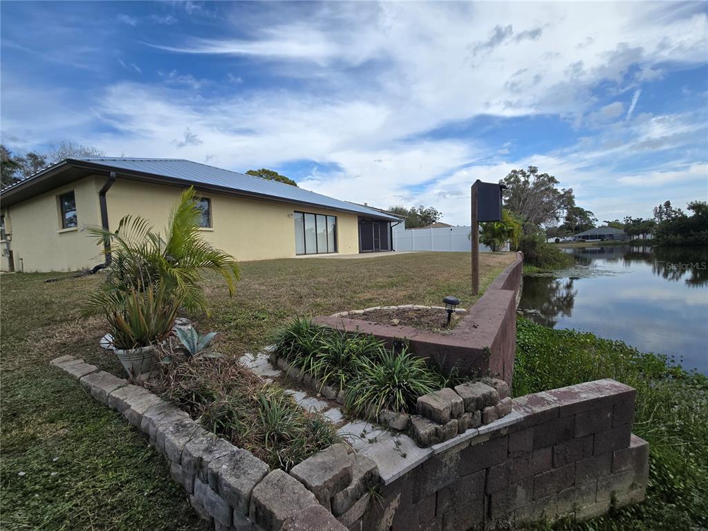 3534 Tundra Road Venice, FL 34293 - Photo 40 of 43 a front view of a house with garden