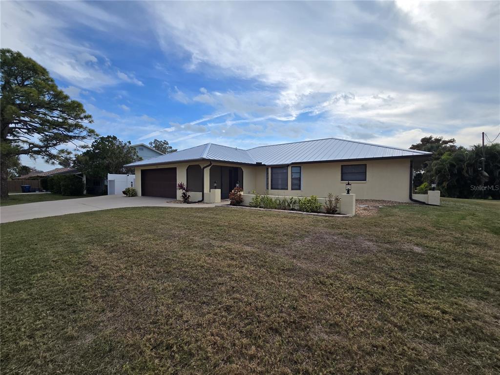 3534 Tundra Road Venice, FL 34293 - Photo 4 of 43 a front view of house with yard and green space