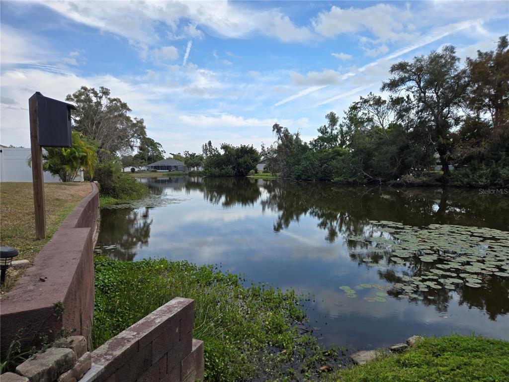3534 Tundra Road Venice, FL 34293 - Photo 42 of 43 a view of a lake with houses in the back