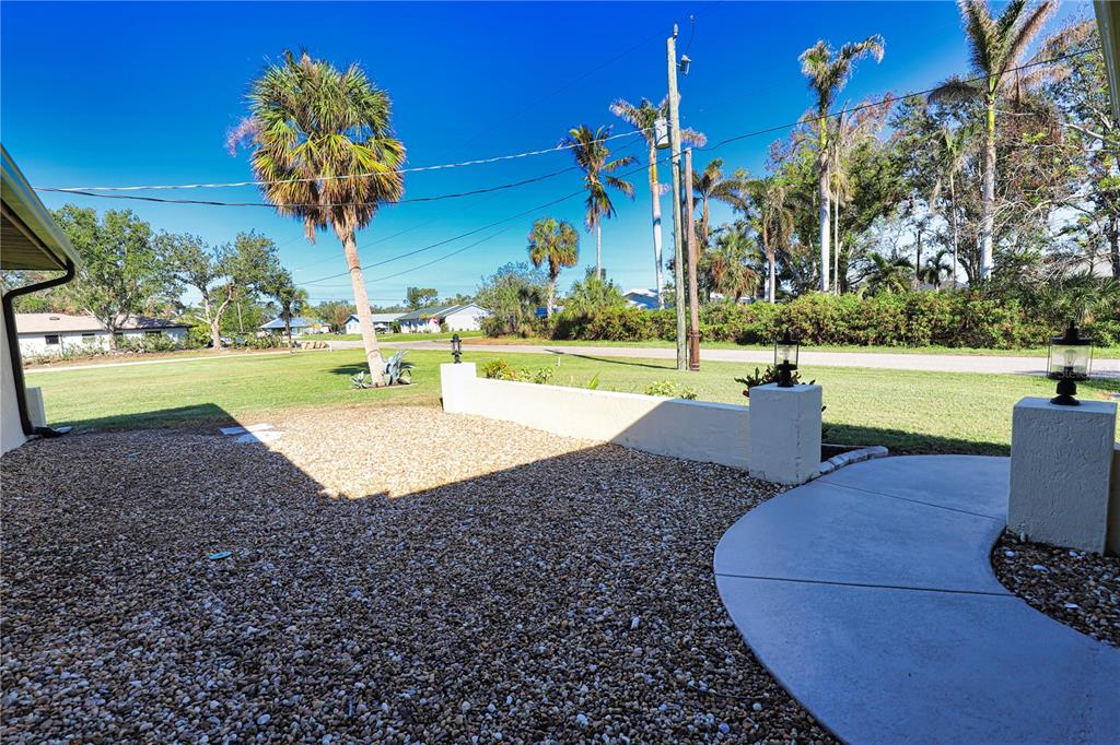 3534 Tundra Road Venice, FL 34293 - Photo 6 of 43 a view of a swimming pool and lounge chair