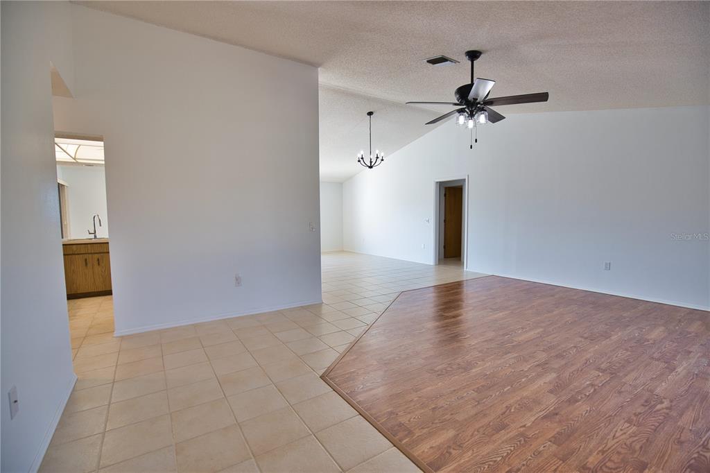 3534 Tundra Road Venice, FL 34293 - Photo 7 of 43 a view of an empty room with a ceiling fan and window