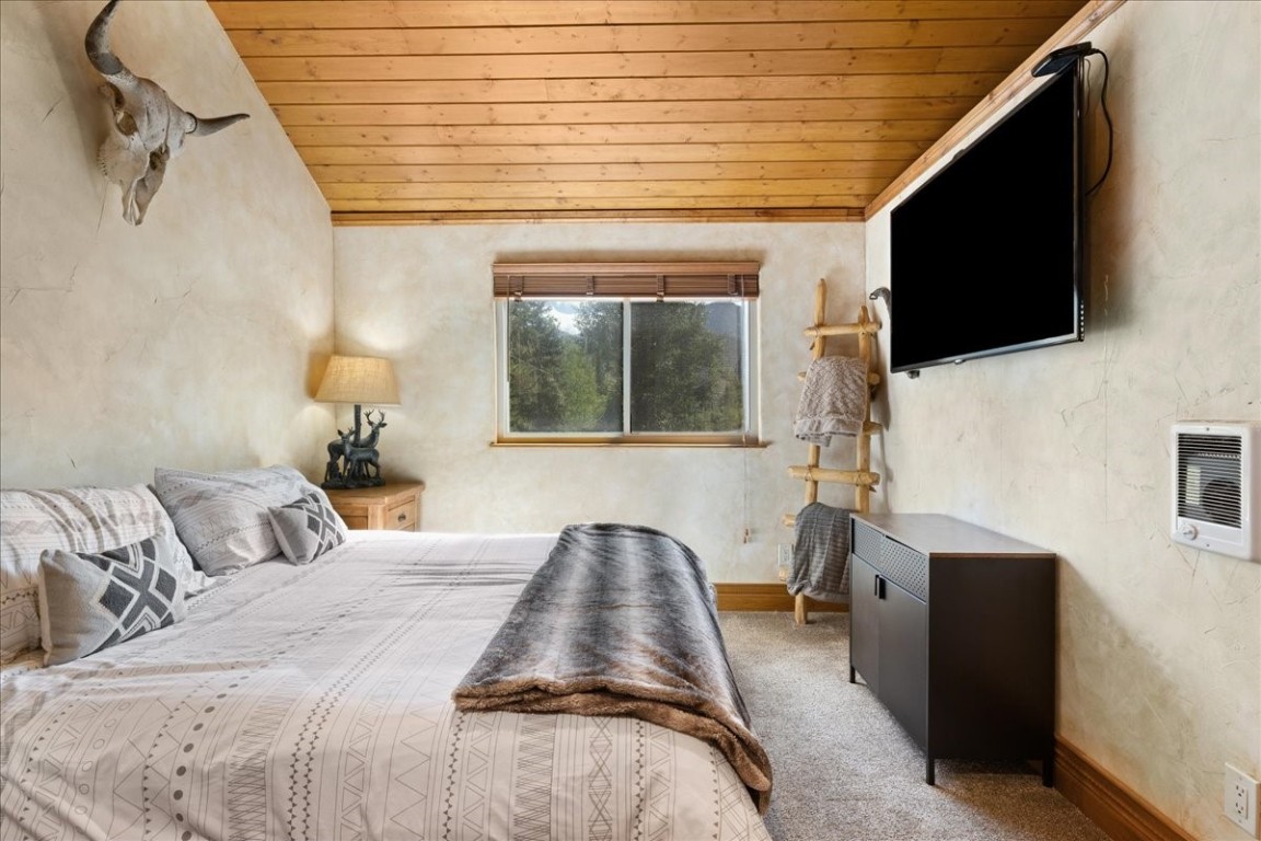 19 East Hanson Road Keystone, CO 80435 - Photo 12 of 24 a bedroom with a bed and a flat tv screen