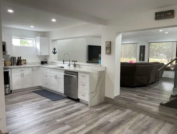 a kitchen with a sink and cabinets