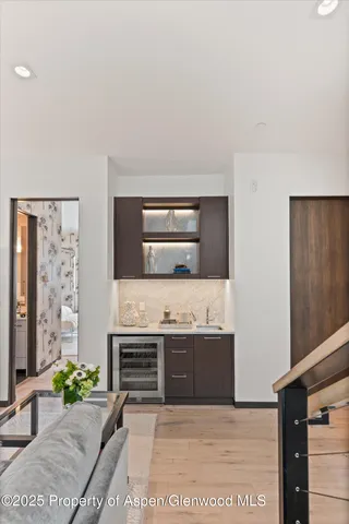 a bathroom with a sink a toilet a mirror a vanity and shower