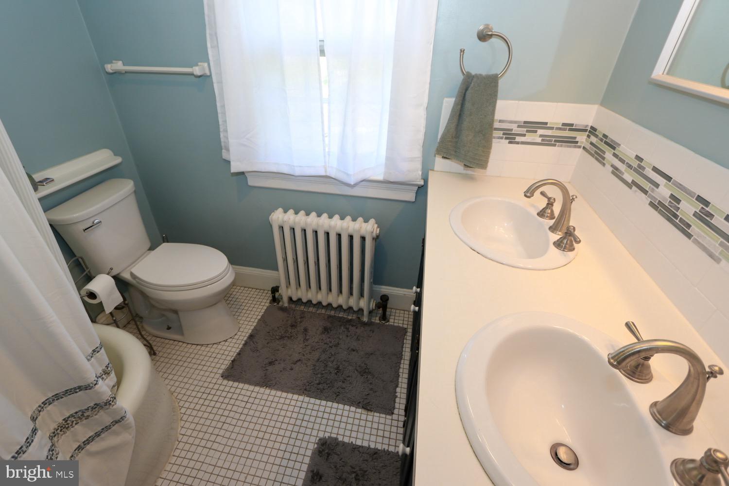 2701 Alden Road Bryn Athyn, PA 19006 - Photo 59 of 105 a bathroom with a sink and a toilet