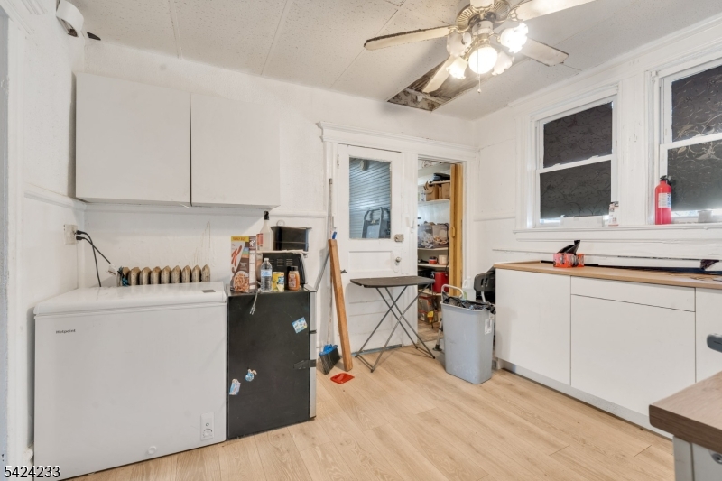 189 Scheerer Avenue Newark, NJ 07112 - Photo 11 of 30 a view of living room with granite countertop furniture and fireplace