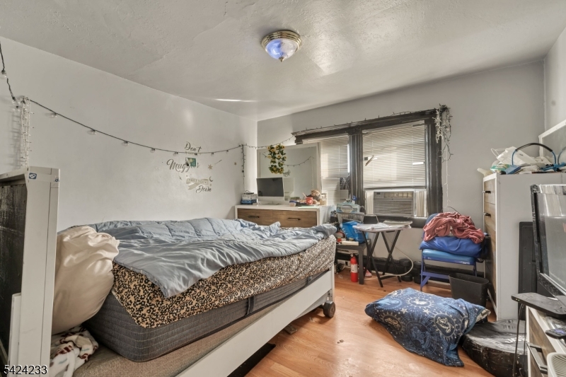 189 Scheerer Avenue Newark, NJ 07112 - Photo 14 of 30 a bedroom with bed and a window