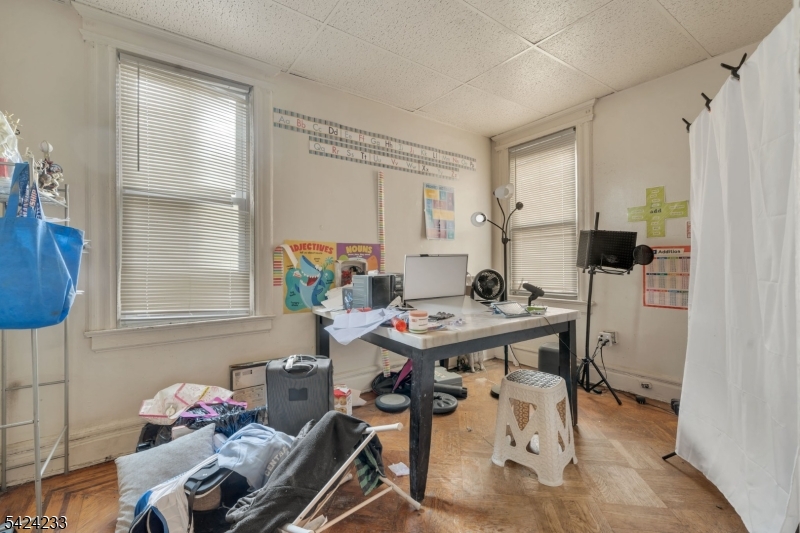 189 Scheerer Avenue Newark, NJ 07112 - Photo 17 of 30 a view of a dining room with furniture and a window