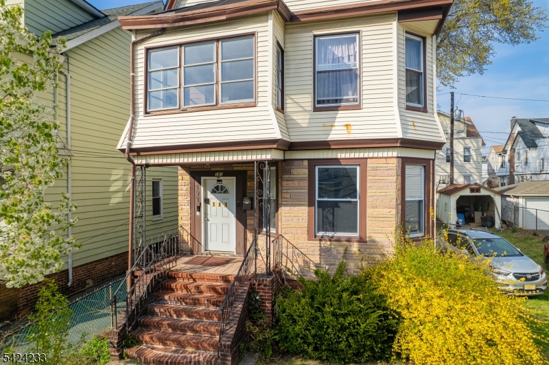 189 Scheerer Avenue Newark, NJ 07112 - Photo 21 of 30 a front view of a house with many windows