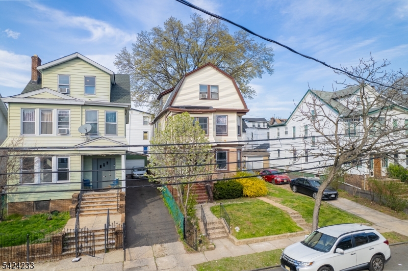 189 Scheerer Avenue Newark, NJ 07112 - Photo 30 of 30 a front view of a house with a garden