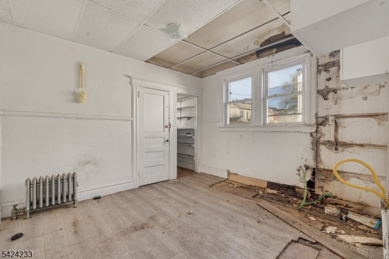 189 Scheerer Avenue Newark, NJ 07112 - Photo 6 of 30 a view of a room with rack on the wall