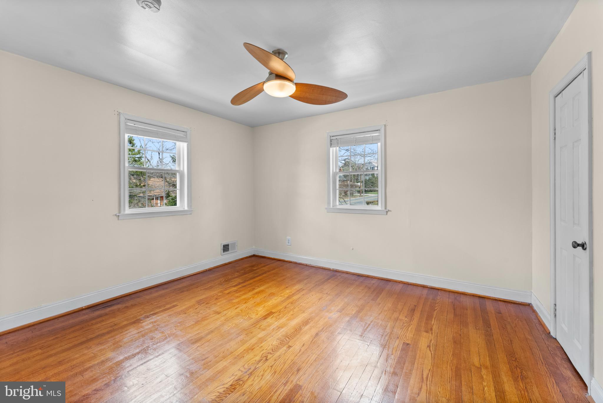 633 Walker Avenue Baltimore, MD 21212 - Photo 11 of 27 a view of an empty room with wooden floor