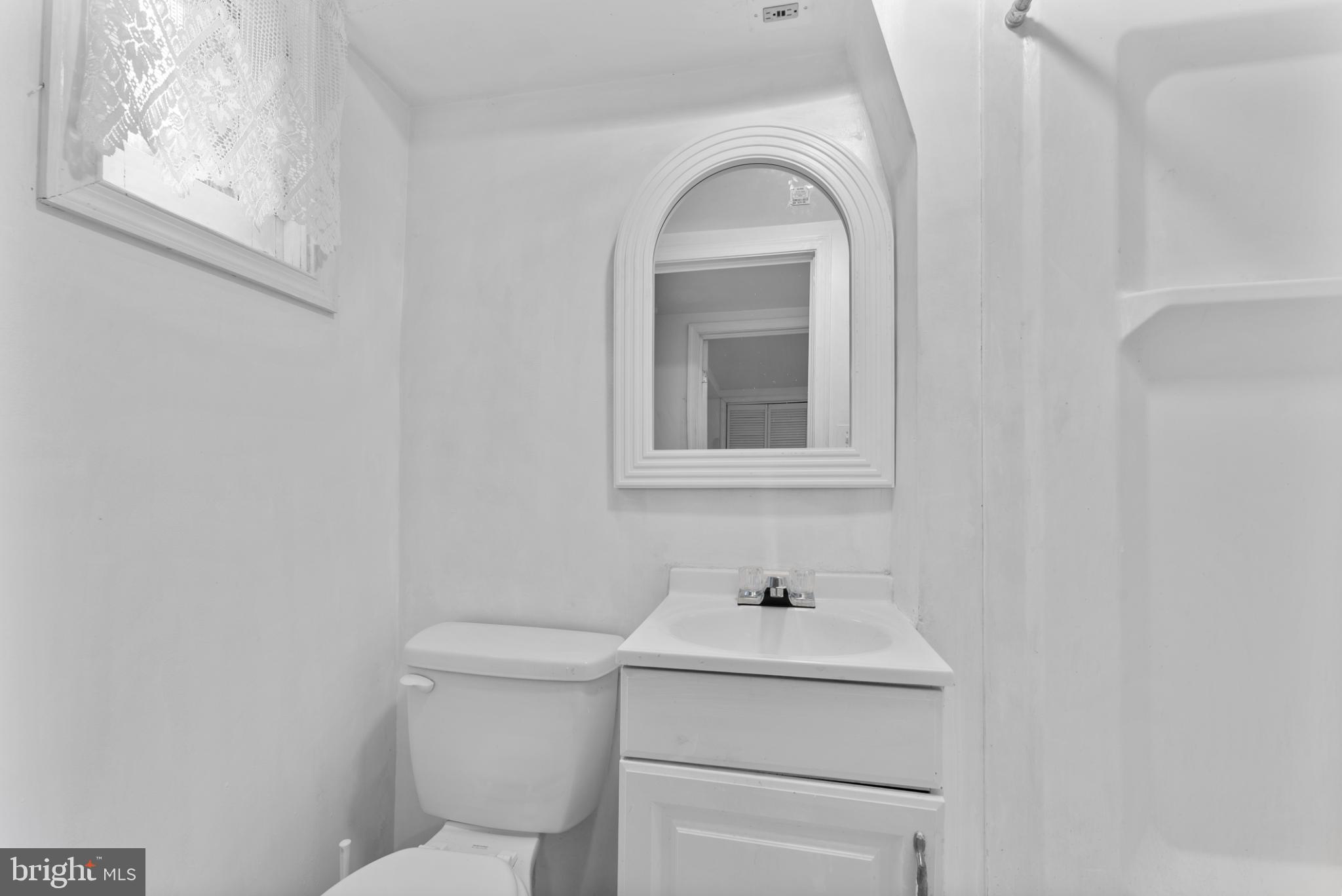 633 Walker Avenue Baltimore, MD 21212 - Photo 19 of 27 a bathroom with a sink and a toilet