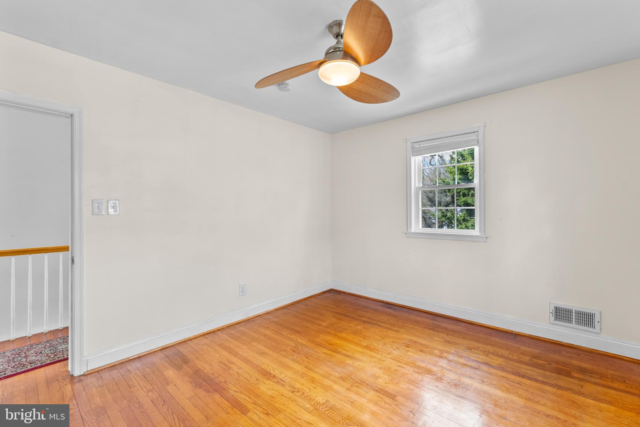 633 Walker Avenue Baltimore, MD 21212 - Photo 21 of 27 a view of empty room with wooden floor