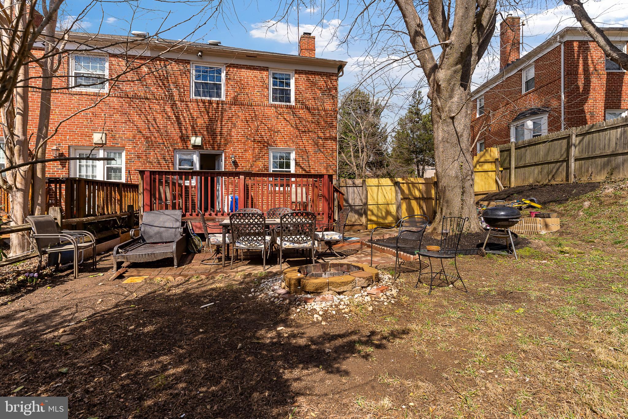 633 Walker Avenue Baltimore, MD 21212 - Photo 5 of 27 a view of a blue house with large trees in front of it