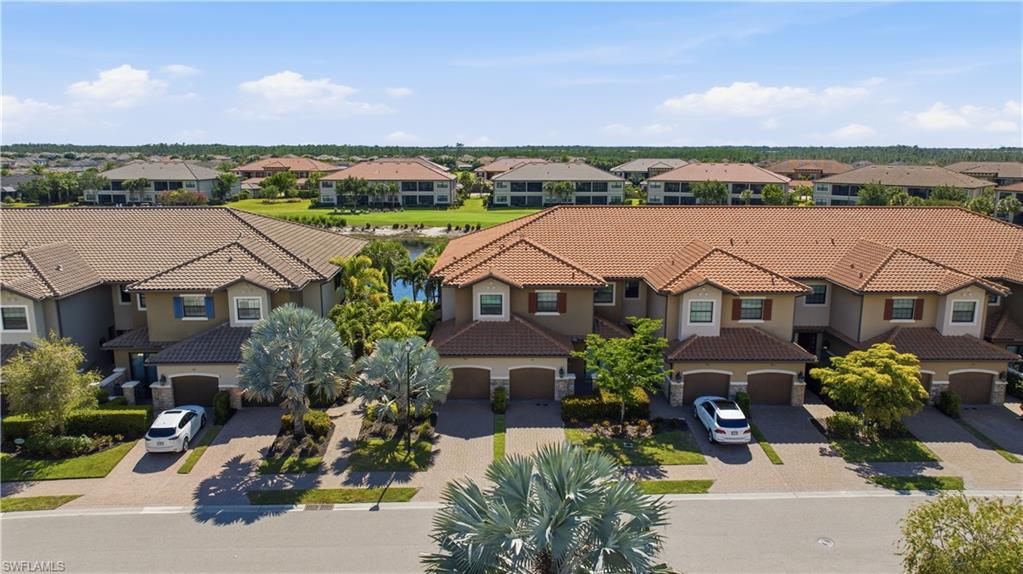 9658 Montelanico Loop, Unit 201 Naples, FL 34119 - Photo 29 of 46 an aerial view of a house