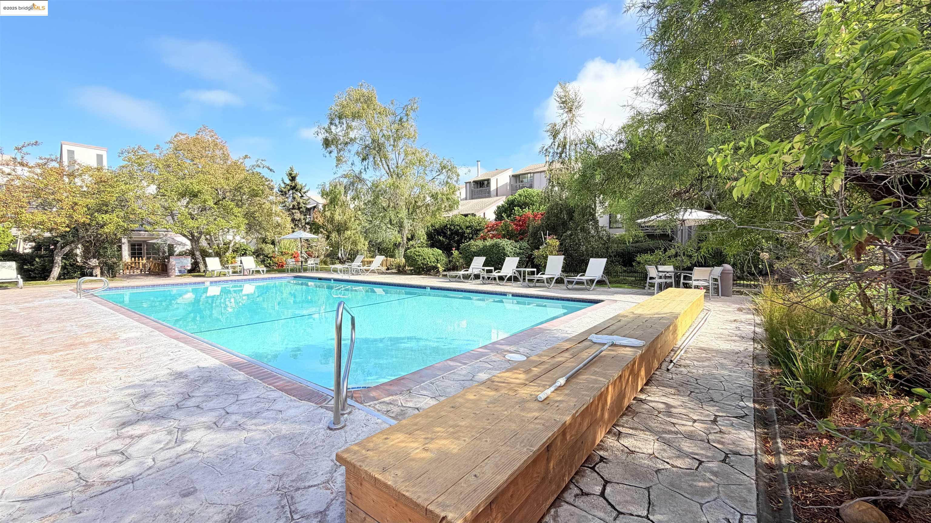 2101 Shore Line Drive, Unit 265 Alameda, CA 94501 - Photo 12 of 34 a view of a swimming pool with an outdoor seating
