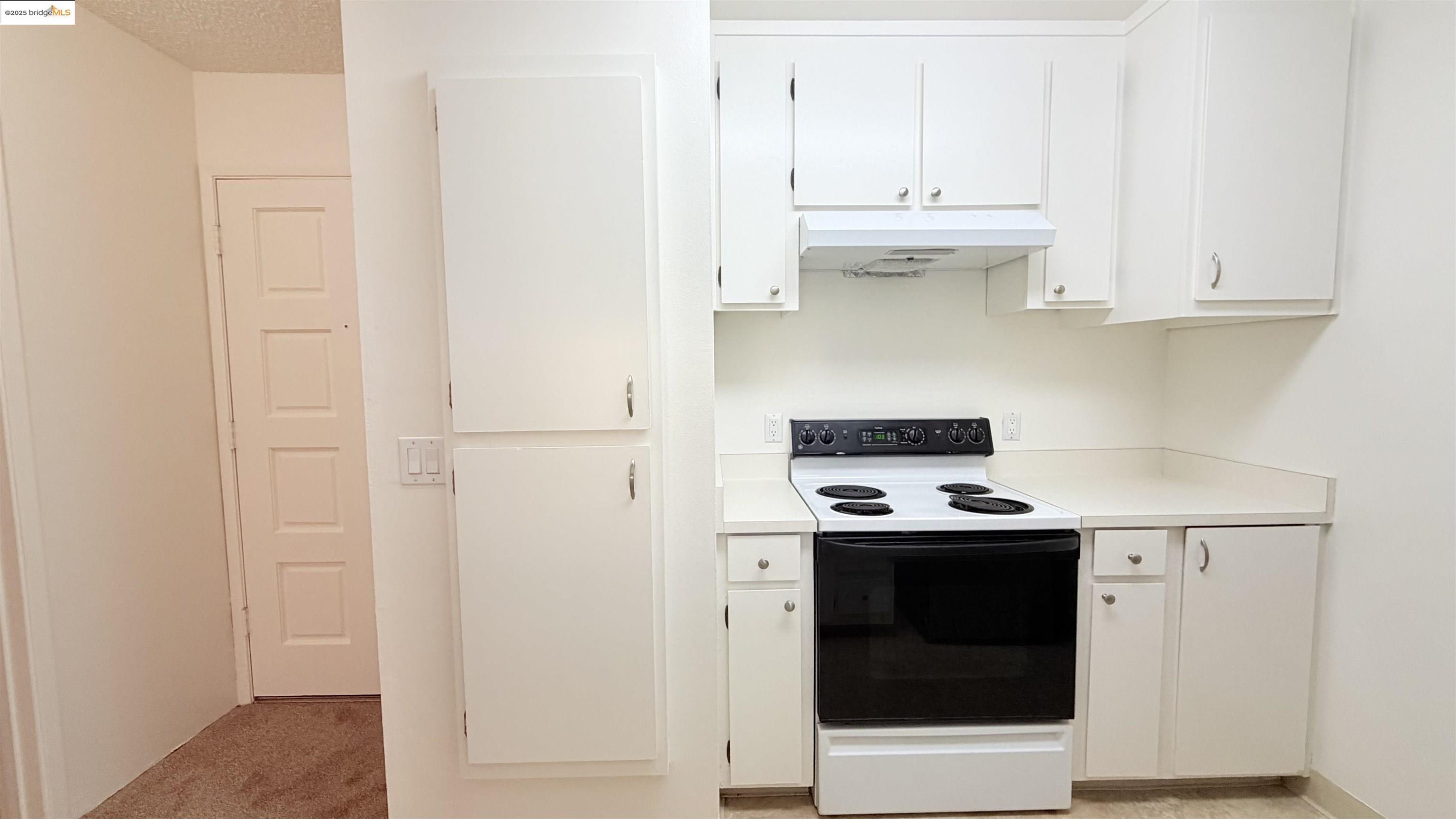 2101 Shore Line Drive, Unit 265 Alameda, CA 94501 - Photo 21 of 34 a kitchen with stainless steel appliances granite countertop white cabinets and a stove