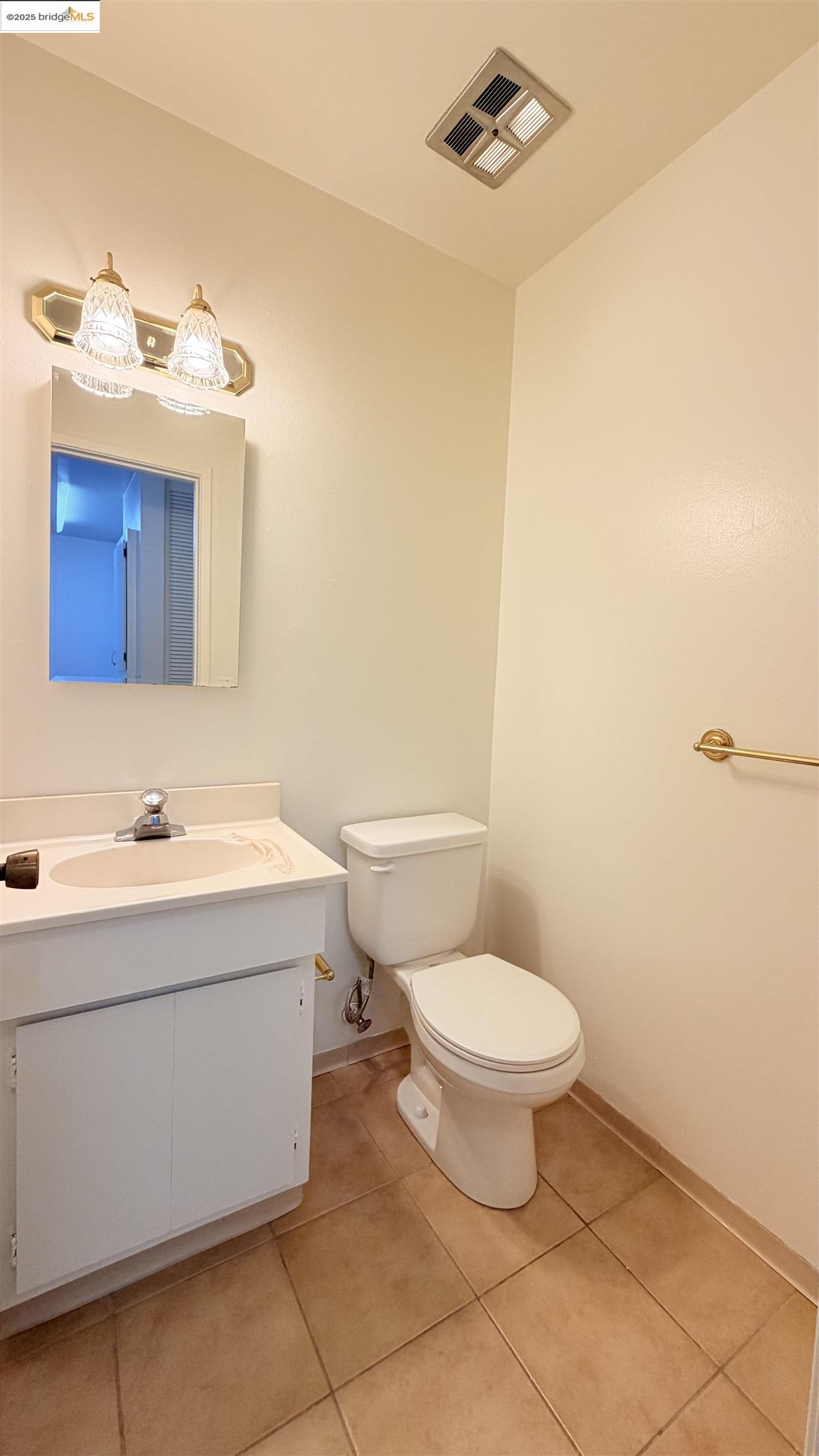 2101 Shore Line Drive, Unit 265 Alameda, CA 94501 - Photo 23 of 34 a bathroom with a sink a toilet and mirror