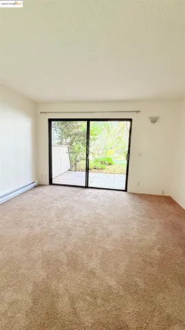 a view of cars parked on the side of a street