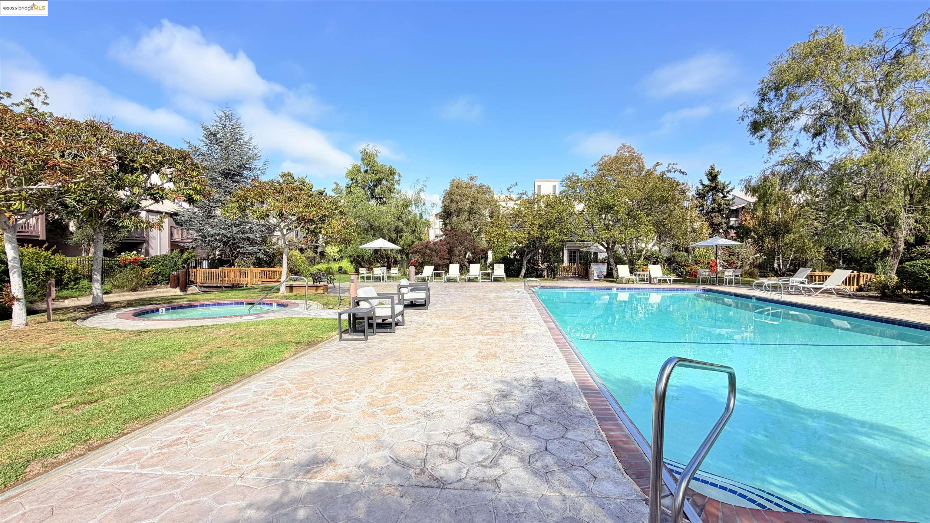 2101 Shore Line Drive, Unit 265 Alameda, CA 94501 - Photo 10 of 34 a view of a swimming pool with a patio and a yard