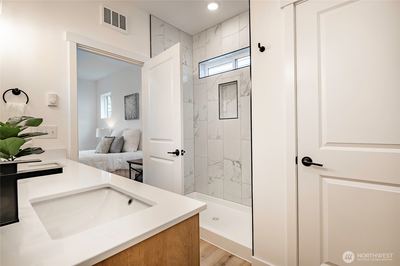2999 Cedar View Road Blaine, WA 98230 - Photo 19 of 37 a bathroom with a sink a mirror and a shower