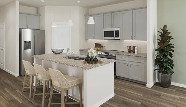 a kitchen with a sink and refrigerator