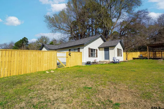 a view of a swimming pool with an outdoor space and seating area