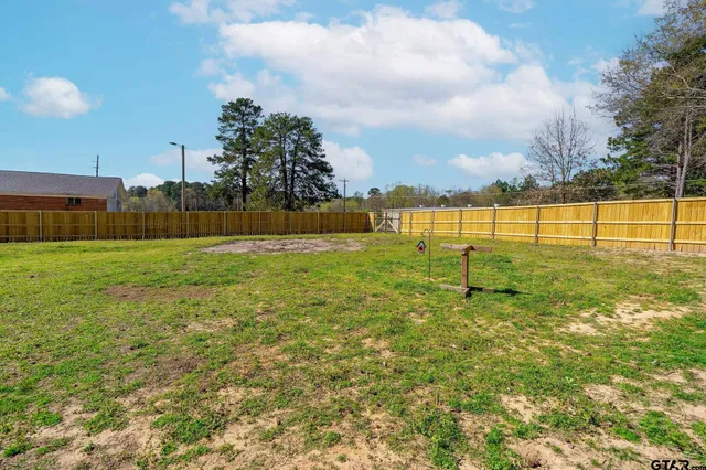 a living room with furniture a rug and a large window
