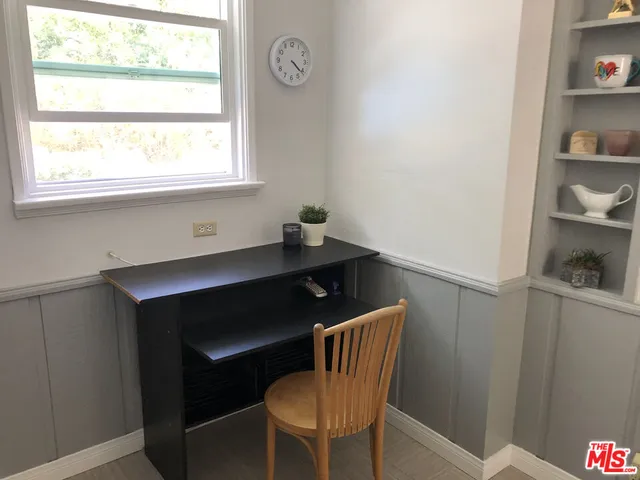 a dining room with a table and chairs