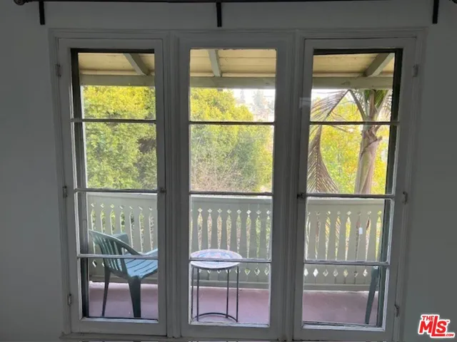 a view of a large window with wooden floor
