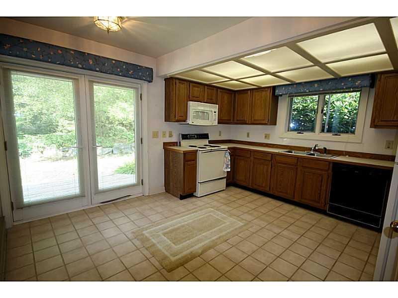 19 West Harbor Pond Road, Unit 19B West Boothbay Harbor, ME 04575 - Photo 3 of 13 Kitchen. Sunny kitchen with deck access.