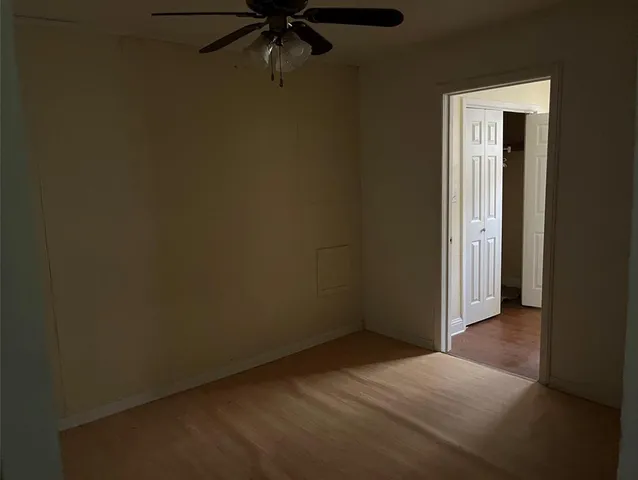 an empty room with a empty space and a window