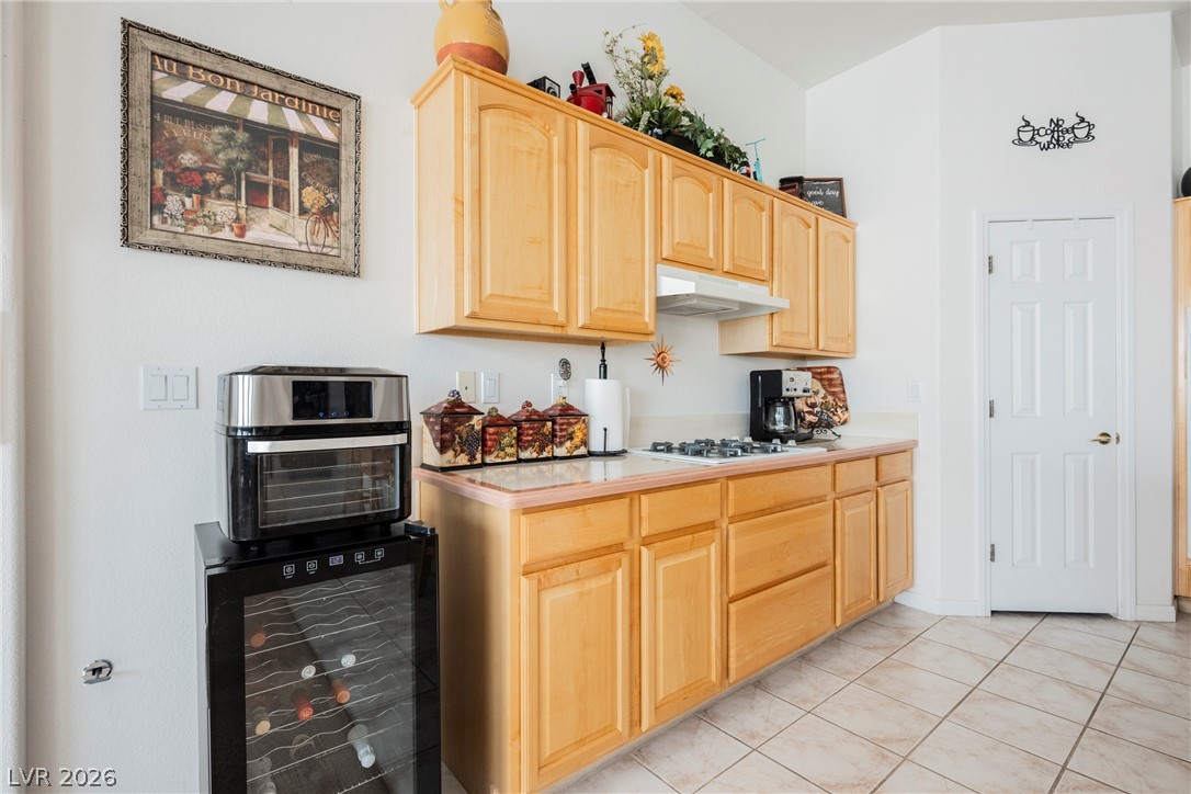 5494 Pine Ranch Street Las Vegas, NV 89113 - Photo 29 of 54 A well-equipped kitchen space features a gas cooktop, built-in range hood, and ample cabinet storage.