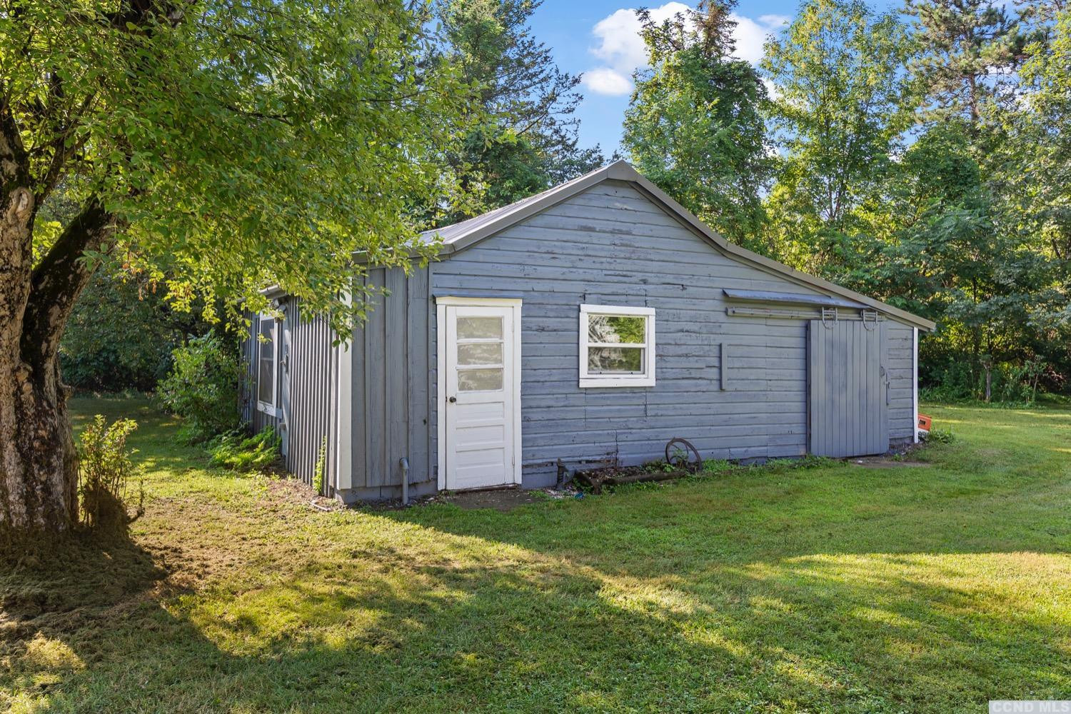 360 Millbrook Road Hudson, NY 12534 - Photo 8 of 27 a view of front of a house with a yard