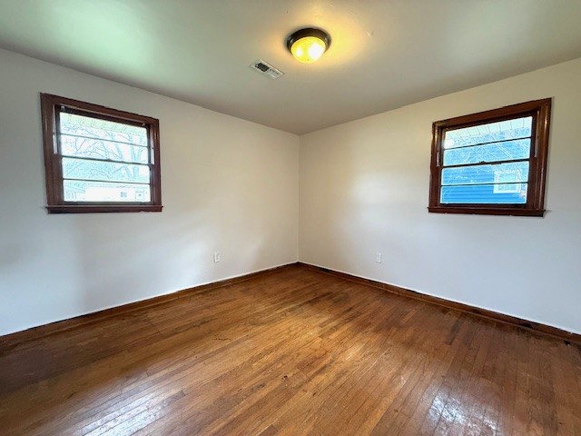 501 Corning Street Anderson, SC 29624 - Photo 6 of 9 This spacious room features ample natural light and beautiful hardwood flooring.