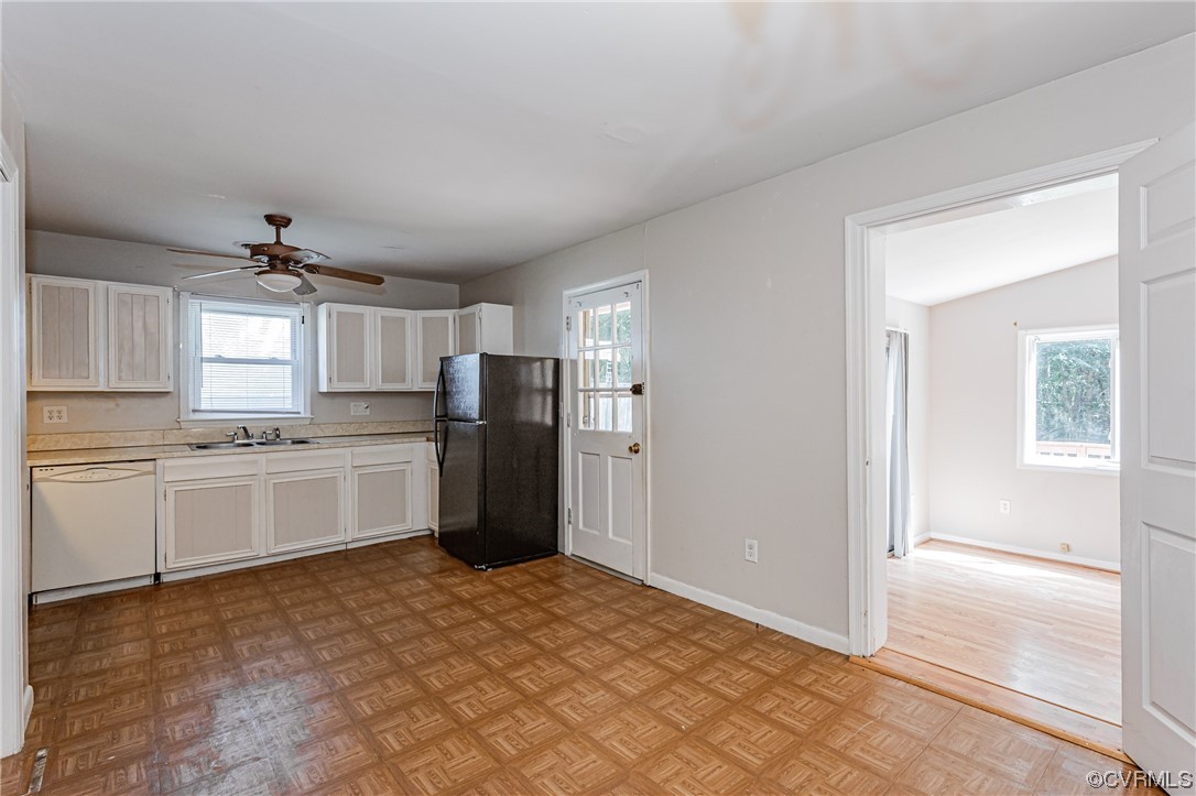 6713 Cherry Road Quinton, VA 23141 - Photo 16 of 50 a kitchen with refrigerator cabinets and white appliances