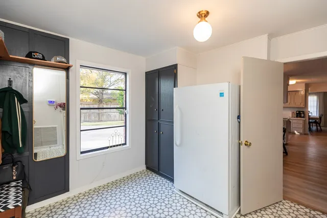 a utility room with cabinets