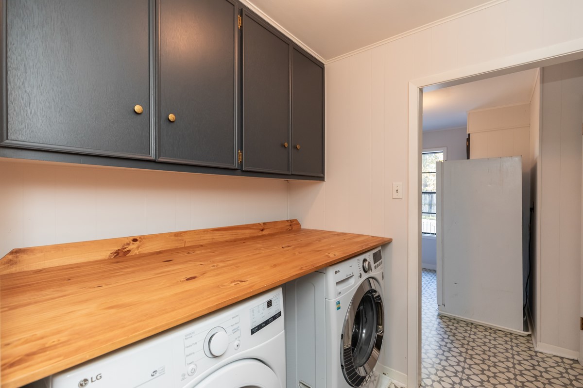 1210 Nottingham Lane Beaumont, TX 77706 - Photo 14 of 50 a utility room with cabinets